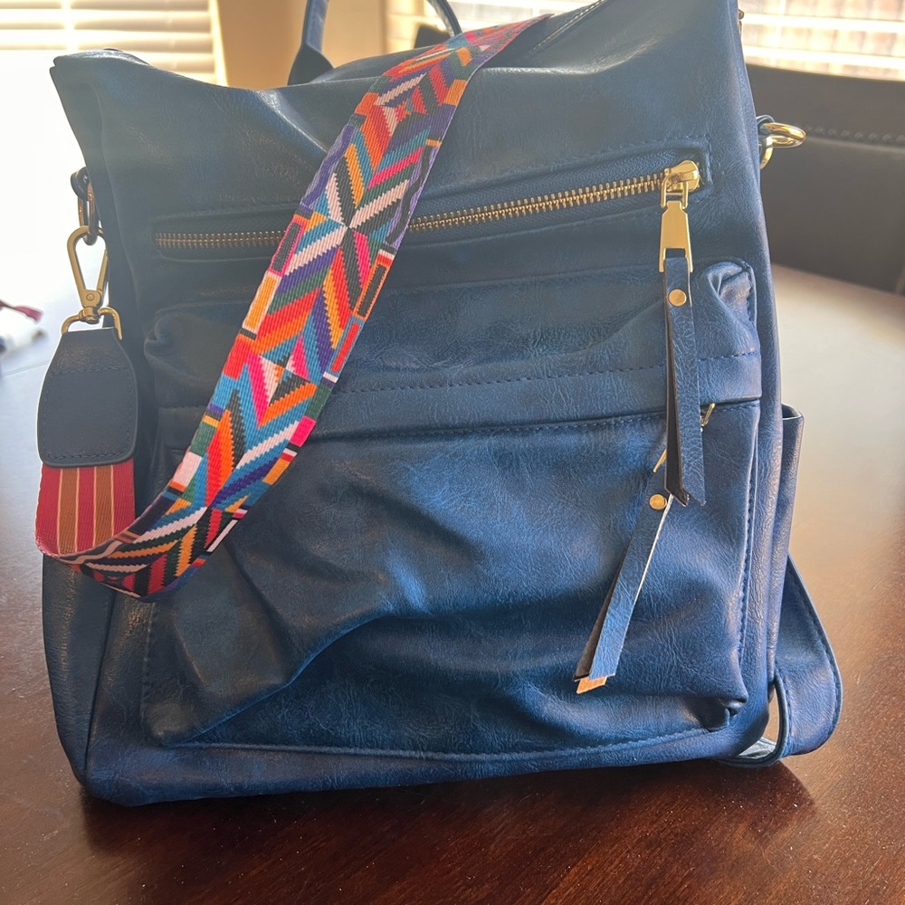Elegant Navy Backpack with Vibrant Strap